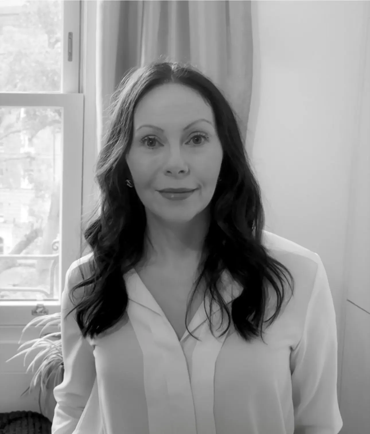 image1 Black-and-white headshot of Victoria with a window behind her.
